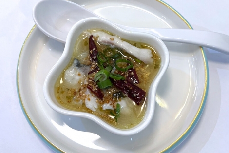 Mini bowl with fish and Chinese vegetables in homemade broth